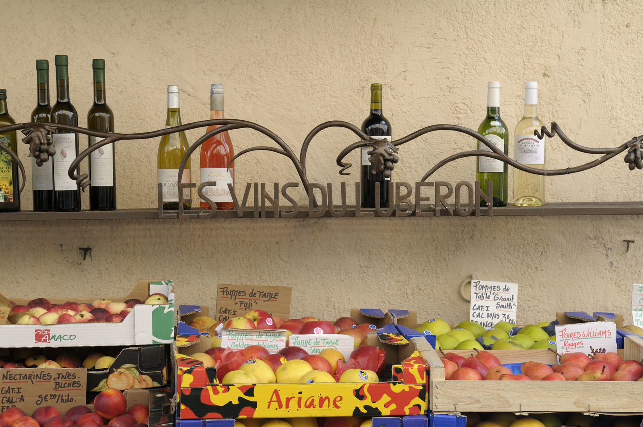 GRAFFITI ON SHELF AGAINST WALL