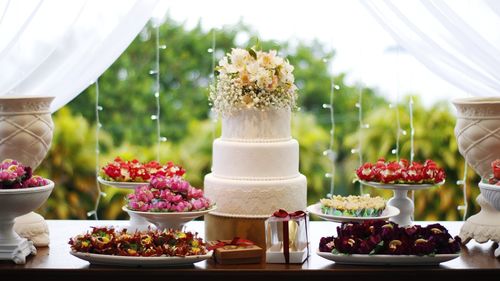 Wedding cake by decoration on table