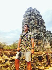 Full length of man standing on rock