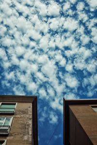 Low angle view of building against blue sky