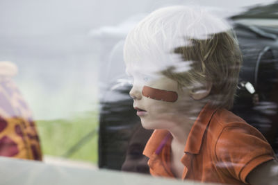 Boy sitting in car