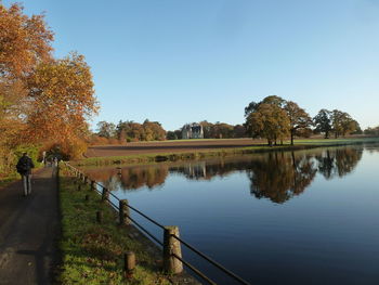 Scenic view of lake against clear sky during autumn