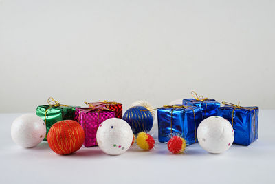 Close-up of multi colored candies against white background