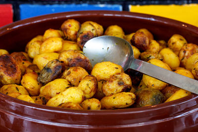 Baked baby potatoes in clay pot