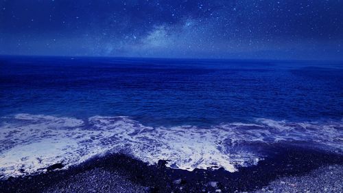 Scenic view of sea at night