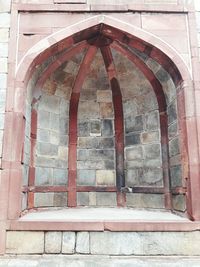 Low angle view of ornate window on old building