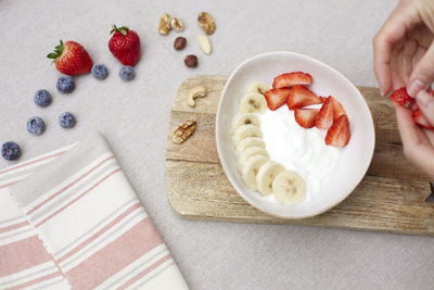 A breakfast bowl with yogurt and fruit