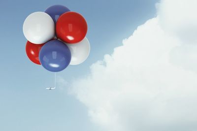 Low angle view of balloons against sky