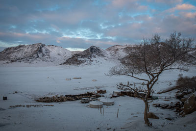 Scenic view of snow covered mountains against sky