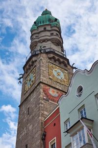 Low angle view of clock tower against sky