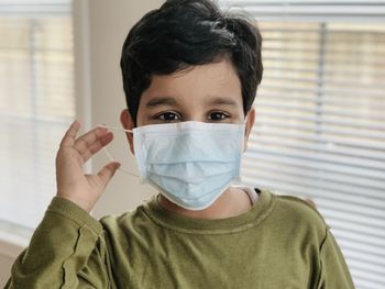 Portrait of boy wearing mask