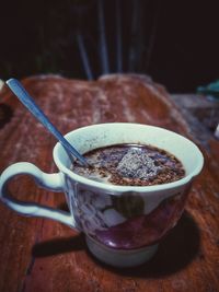 Close-up of coffee cup on table