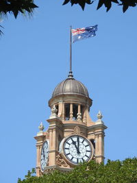 Low angle view of clock tower against sky