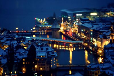 High angle view of illuminated buildings in city at night