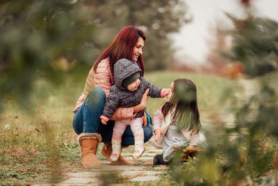 Full length of mother with daughter