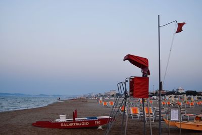 Lifeguard hut on beach against clear sky