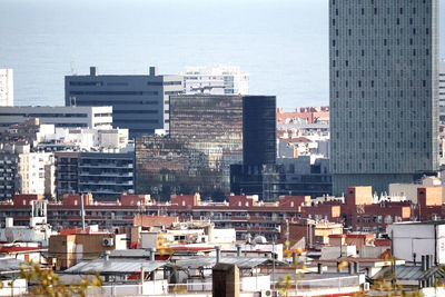 High angle view of buildings in city against sky