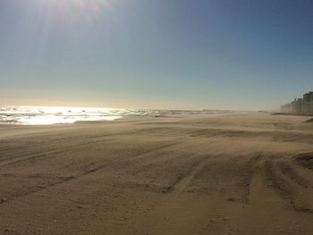 Scenic view of beach against clear sky