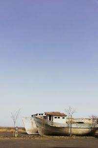 Abandoned boat against clear sky