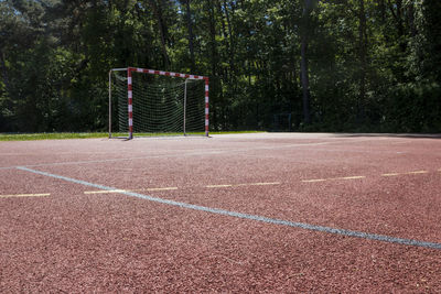 View of soccer field against trees