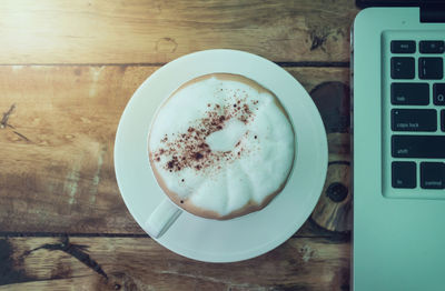 Directly above shot of coffee cup on table