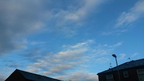 High section of building against cloudy sky