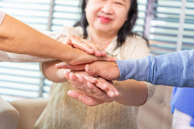 Midsection of woman holding hands