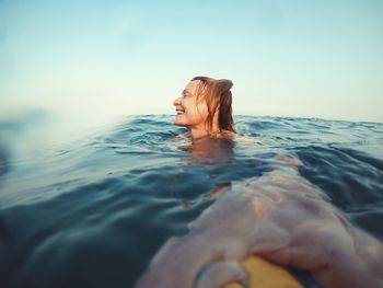 Portrait of woman swimming in sea