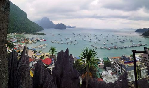 High angle view of sea and buildings against sky