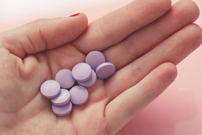 Cropped image of hand holding medicines