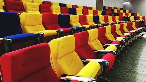Multi colored chairs in row