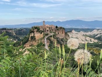 Castle on mountain against sky