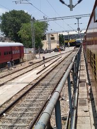 Train at railroad station platform against sky