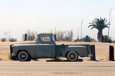 Side view of a classic vintage american pick up truck car in the street