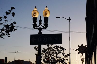 Low angle view of street light against sky