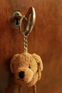 Close-up of keyring charm hanging on door