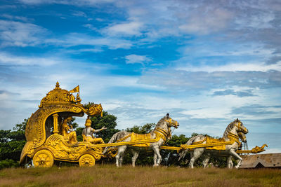 Holly arjuna chariot of mahabharata in golden color with amazing sky background