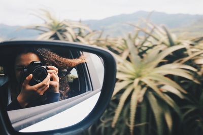 Woman photographing through camera