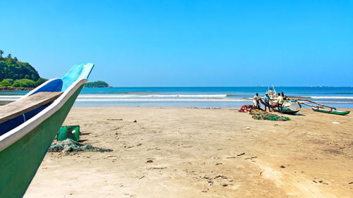 Scenic view of beach against clear sky