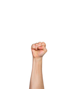 Close-up of human hand against white background