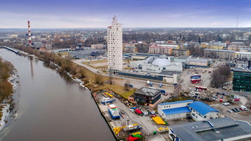 High angle view of traffic on road by buildings against sky