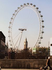 Low angle view of ferris wheel against sky