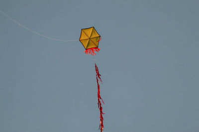 The kite is simple but beautiful hexagon with simple red tail