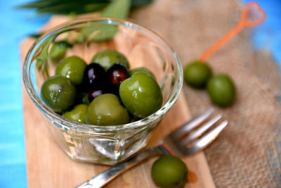 Close-up of fruits in glass bowl on table