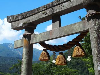 Low angle view of old torii gate