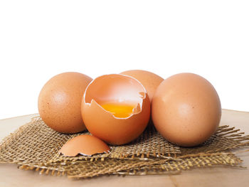 Close-up of eggs against white background