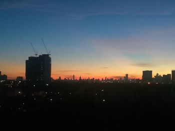 Silhouette of city at night