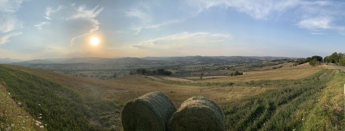 Scenic view of agricultural field against sky in marche, italy