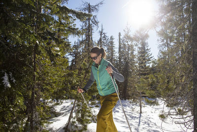 Young man standing in forest