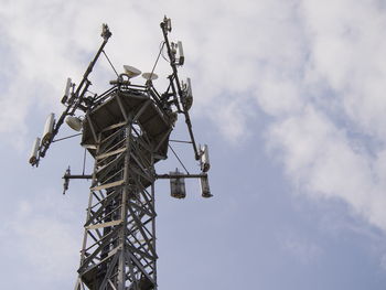 Low angle view of repeater tower against sky